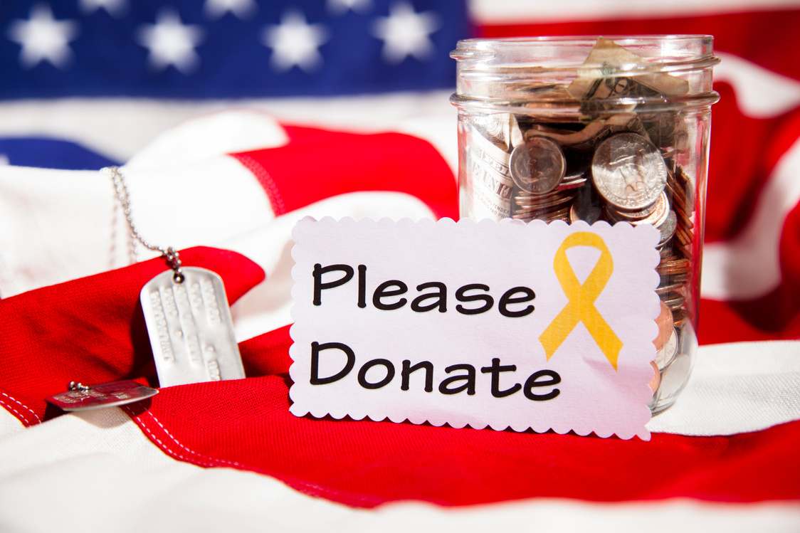 "Please Donate" note, collection jar. American flag. Fundraiser for military.